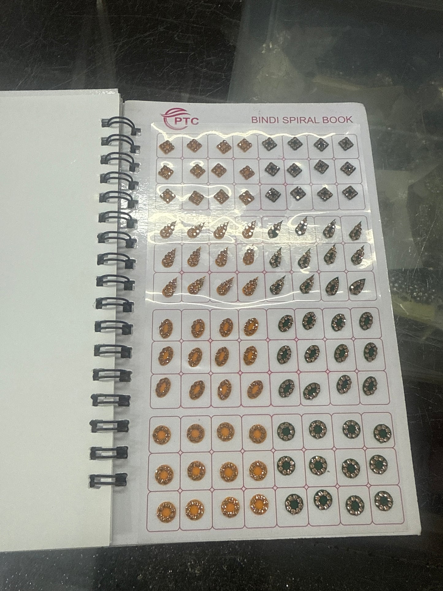 Beautiful designer gold stone tikka/bindi book