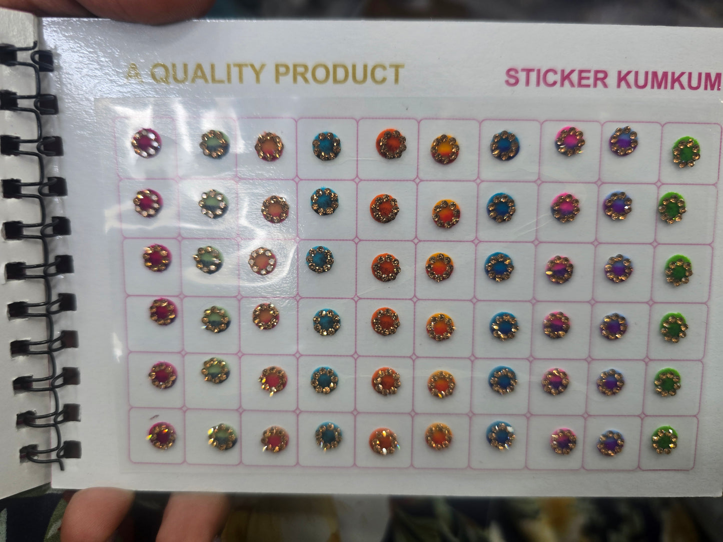 Beautiful designer gold stone tikka/bindi book