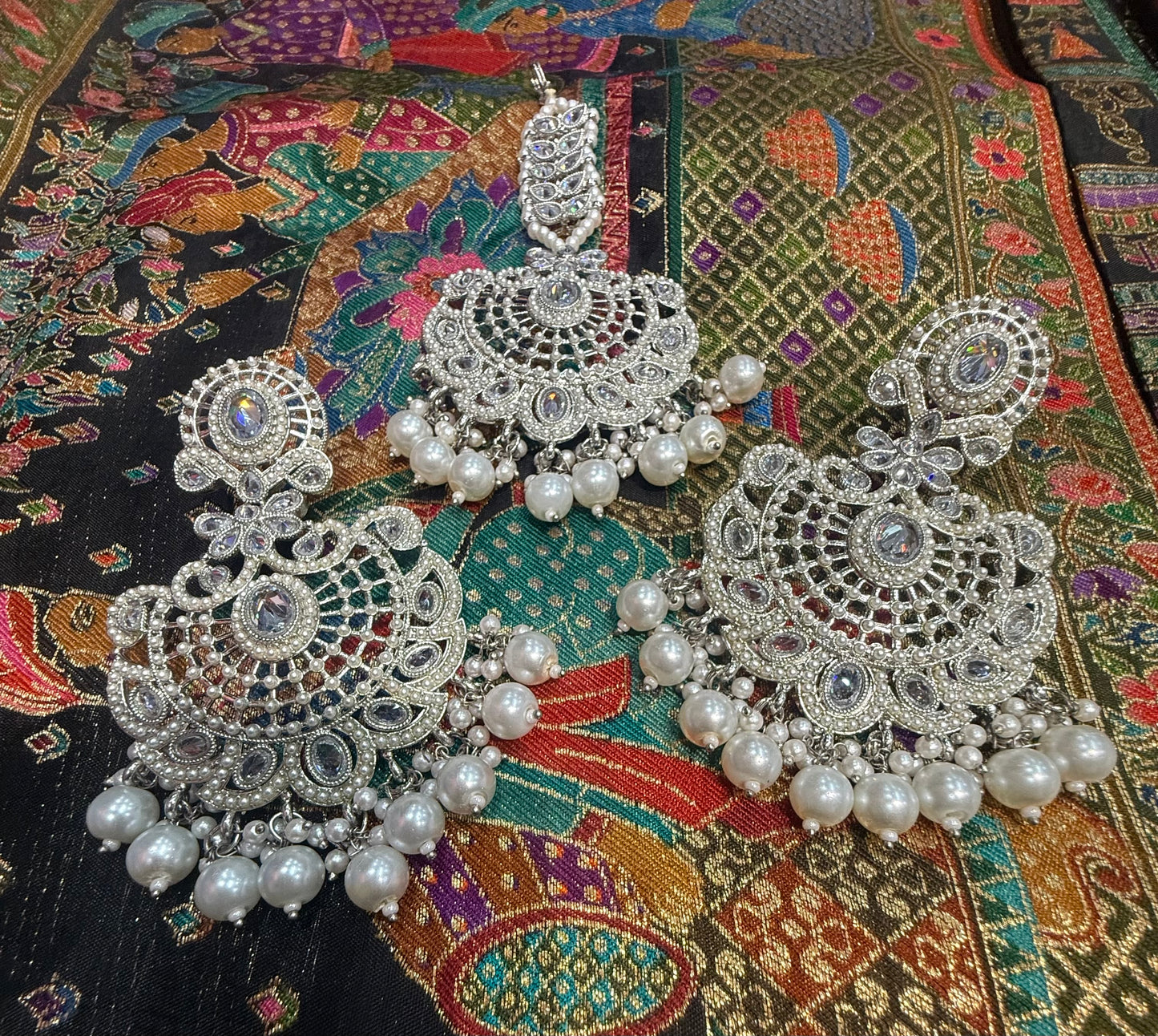 Beautiful polki earrings with tikka/bindi