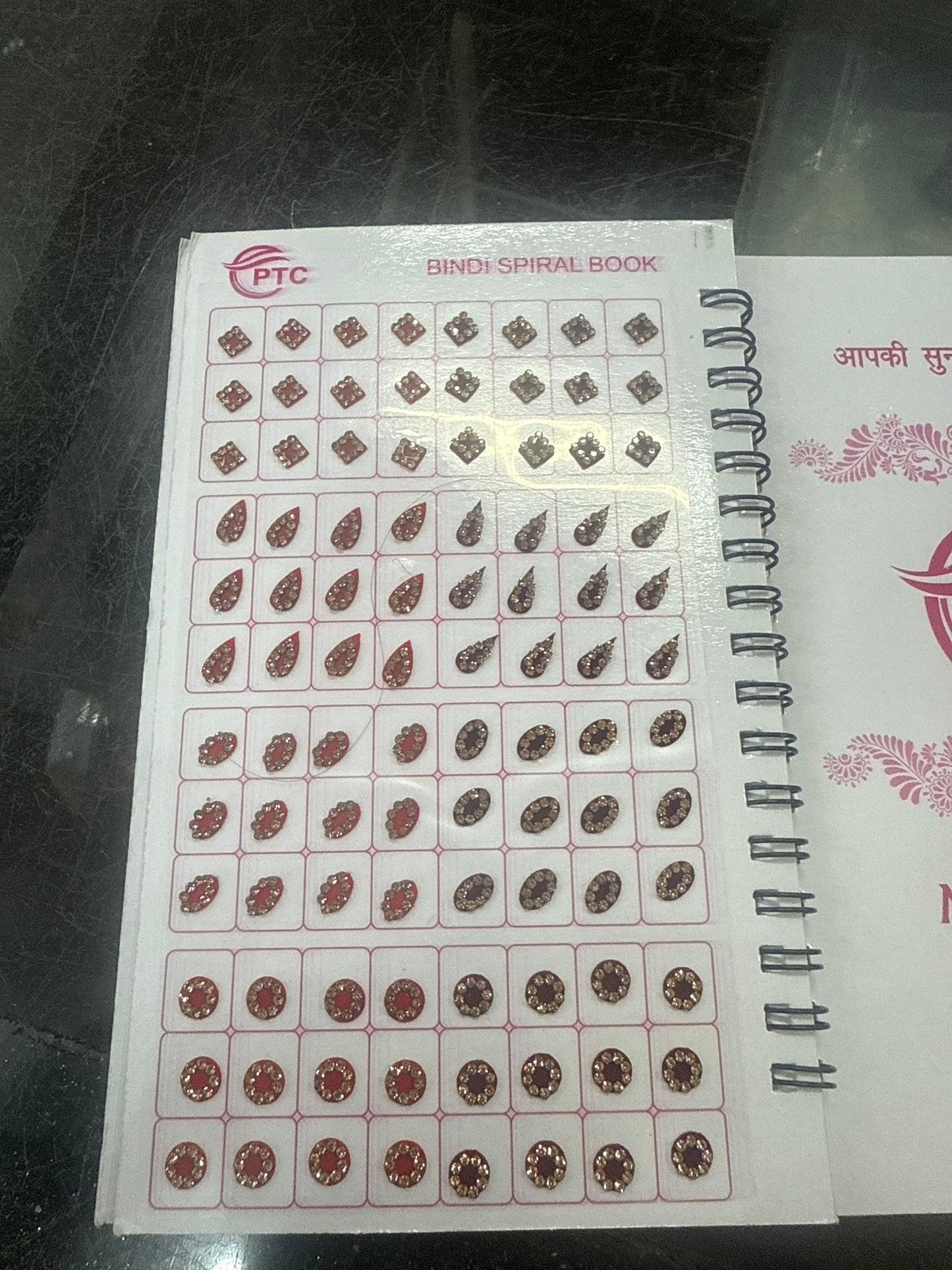 Beautiful designer gold stone tikka/bindi book