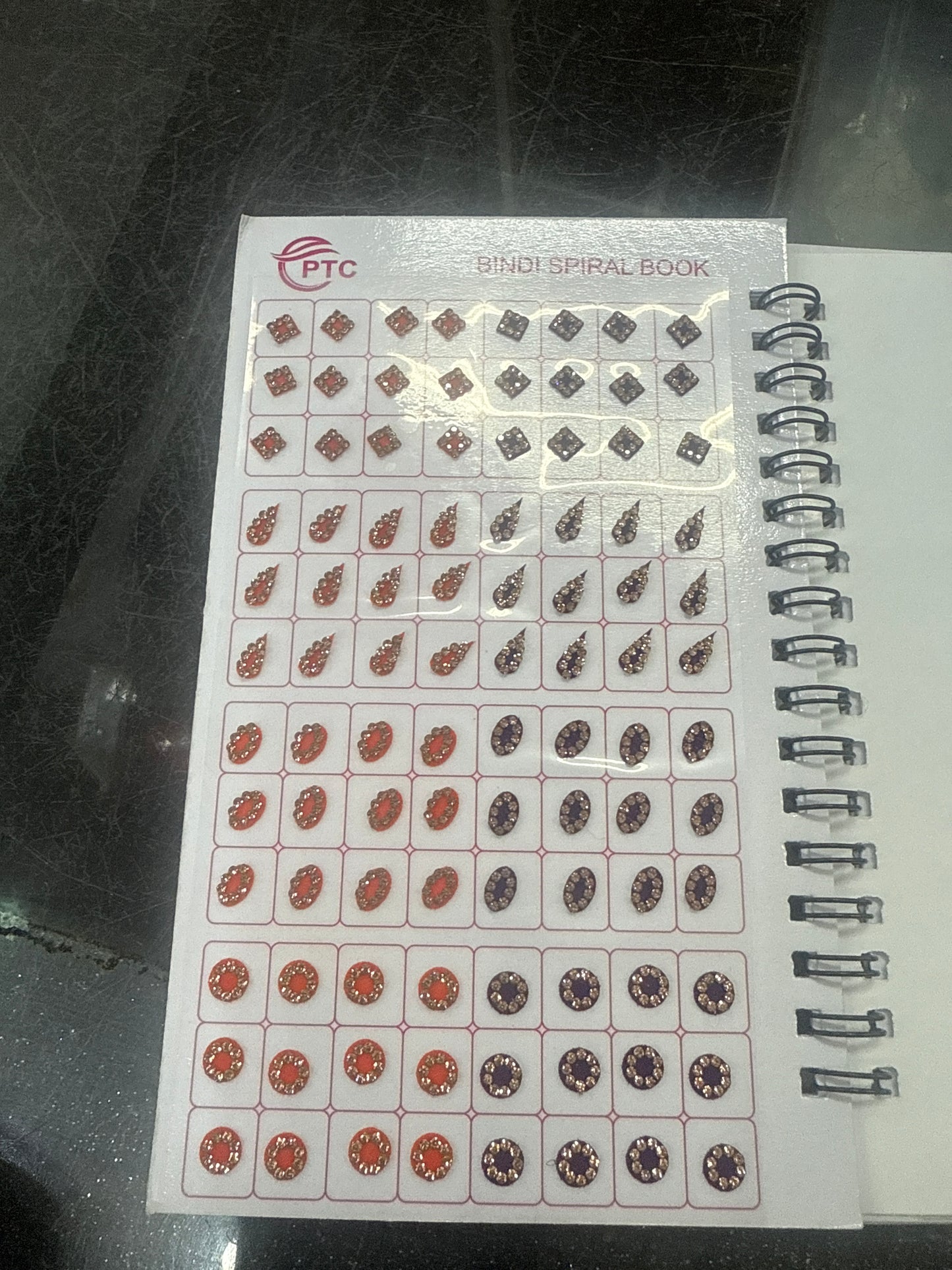 Beautiful designer gold stone tikka/bindi book