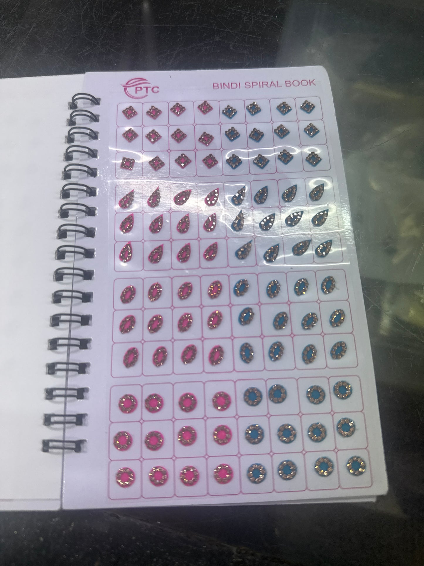 Beautiful designer gold stone tikka/bindi book