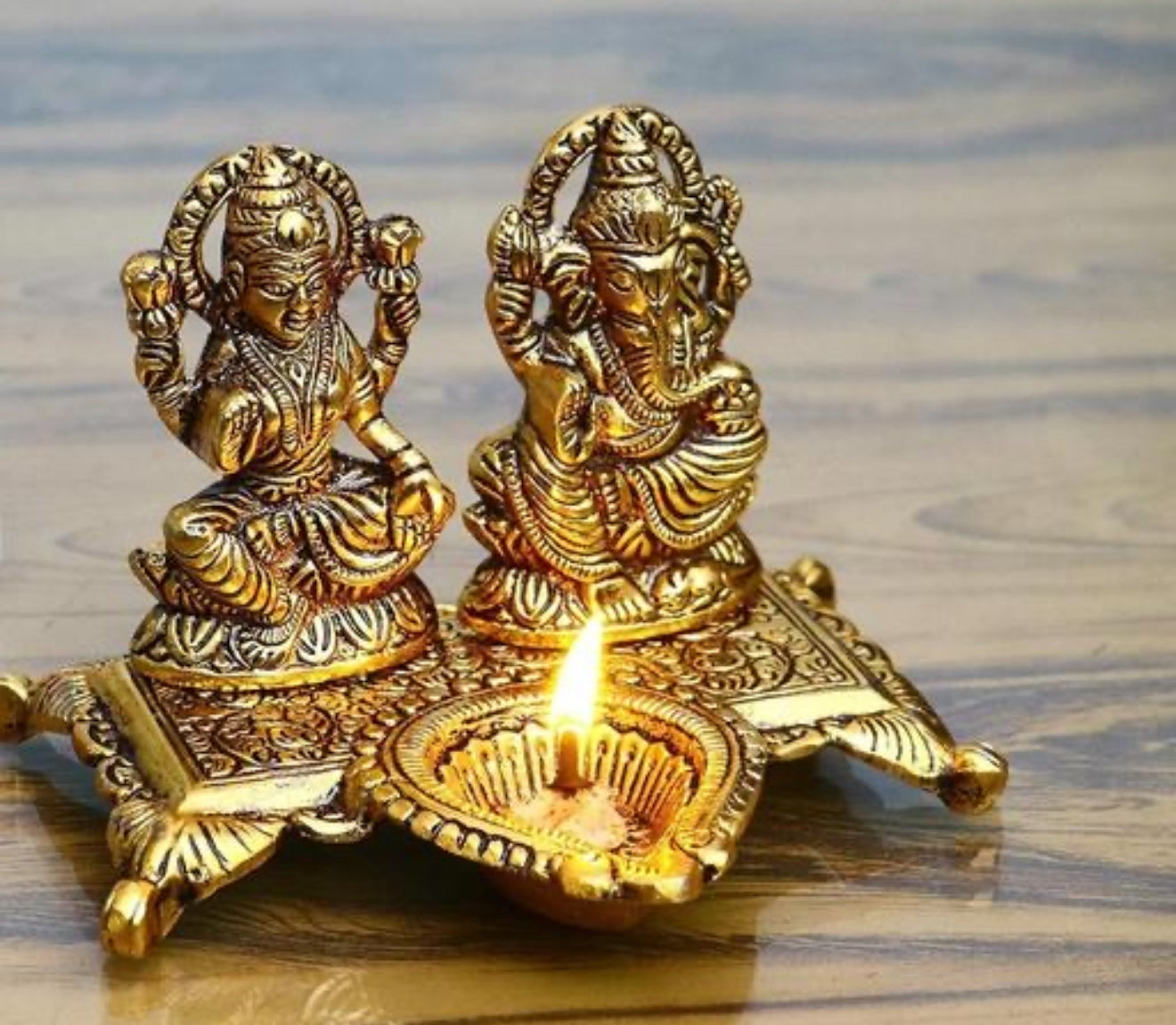 Beautiful lakhmi Ganesh murti with Diya