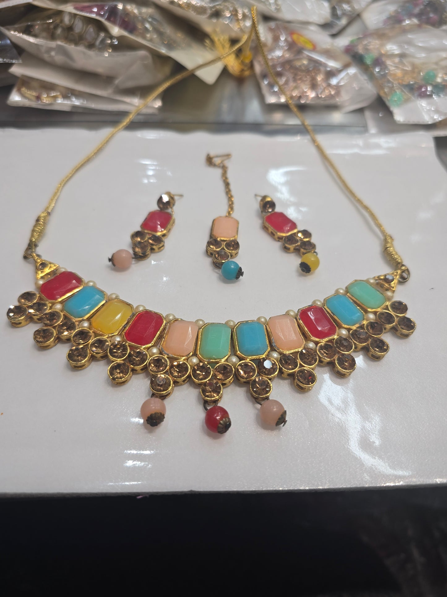 Beautiful designer necklace set with matching studs earrings and bindi