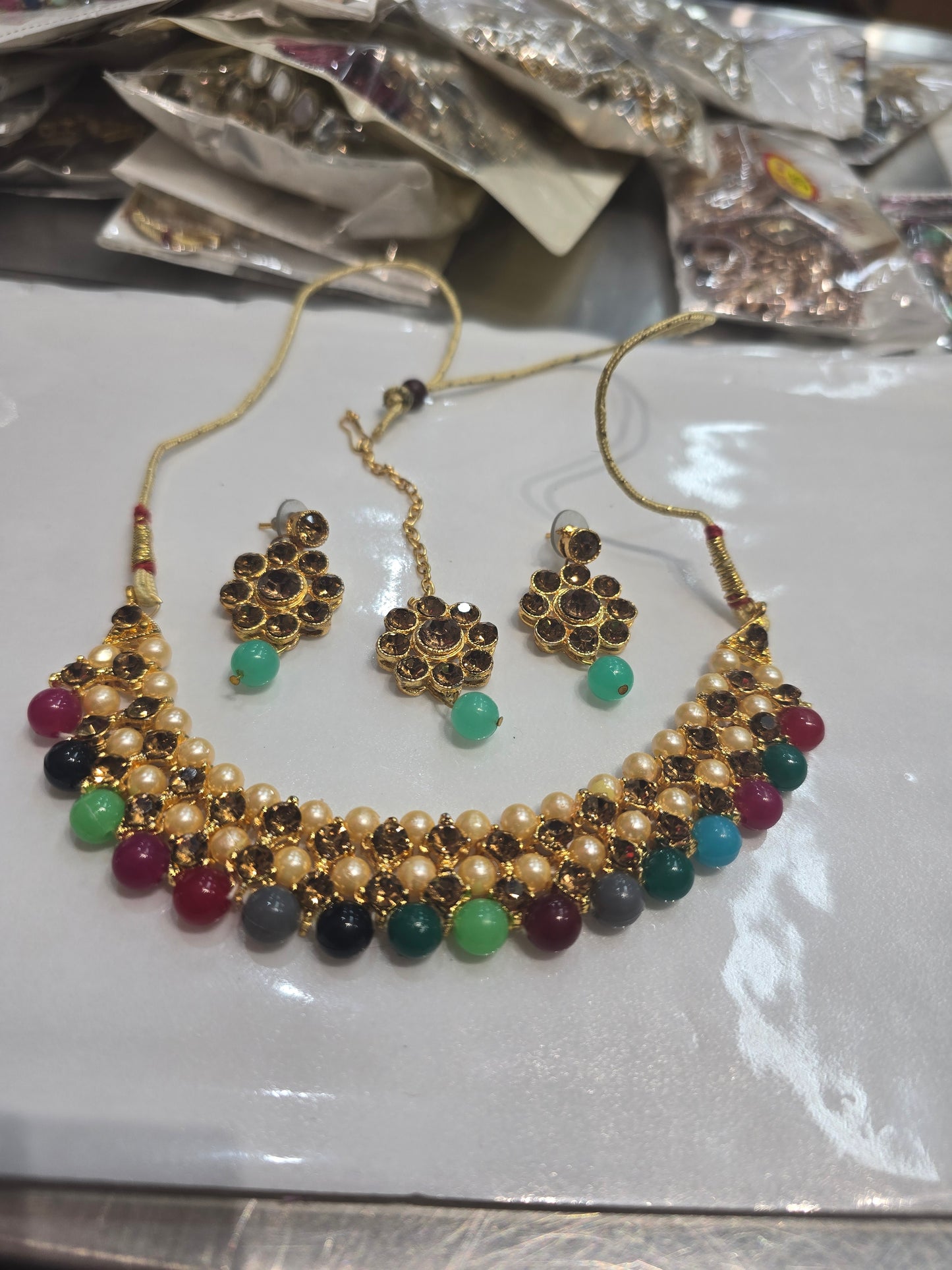Beautiful designer necklace set with matching studs earrings and bindi