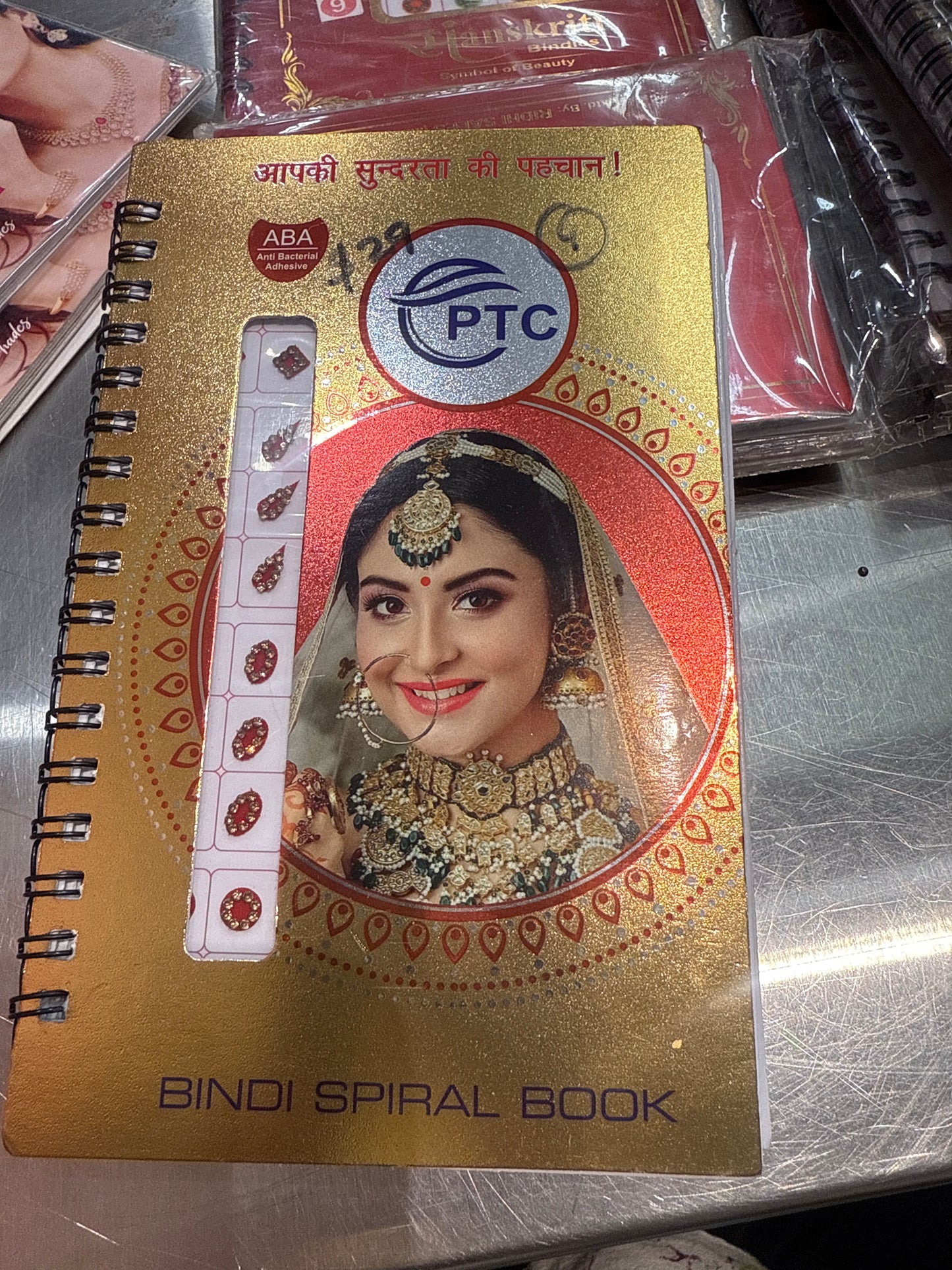 Beautiful designer gold stone tikka/bindi book