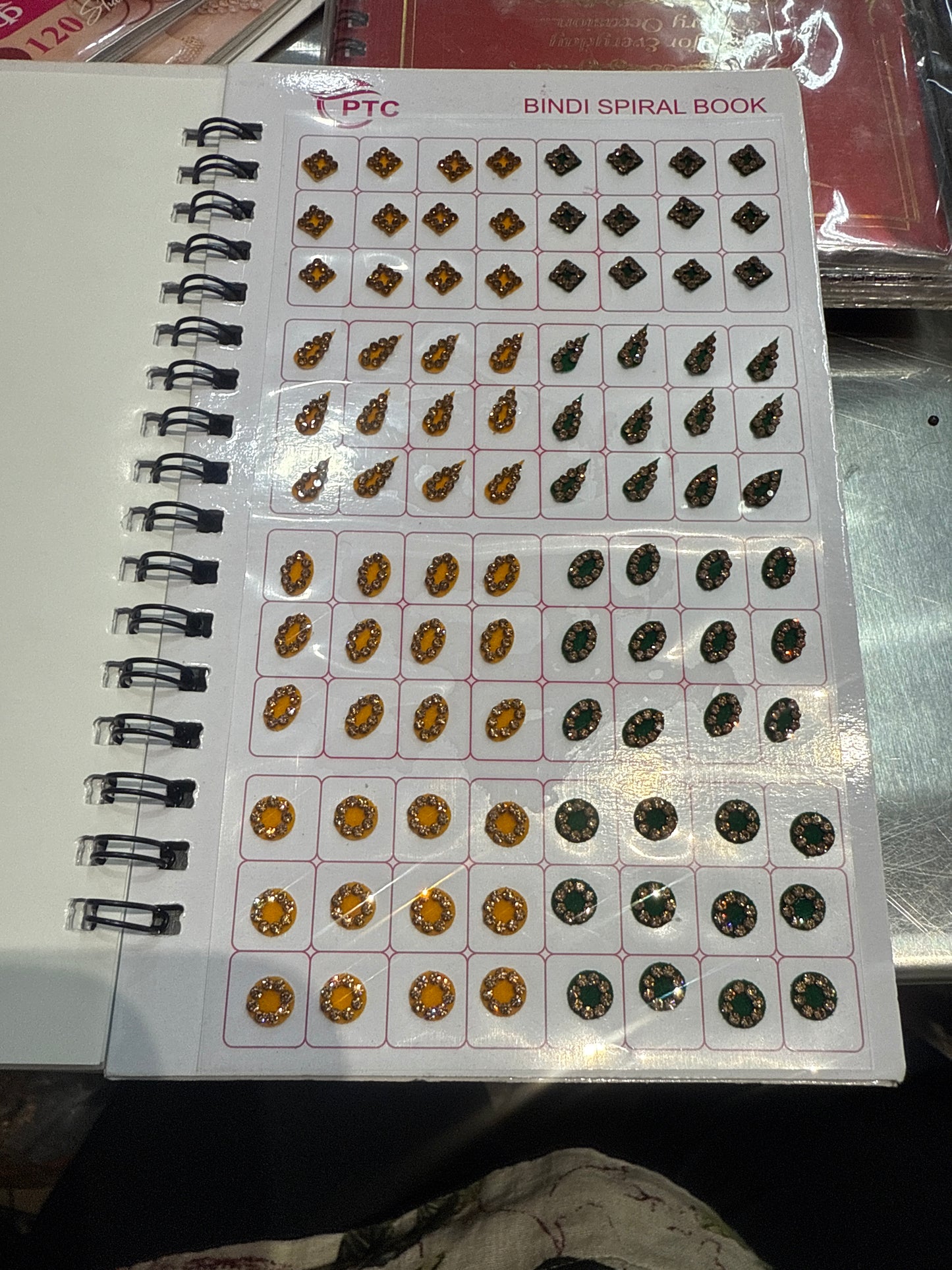 Beautiful designer gold stone tikka/bindi book