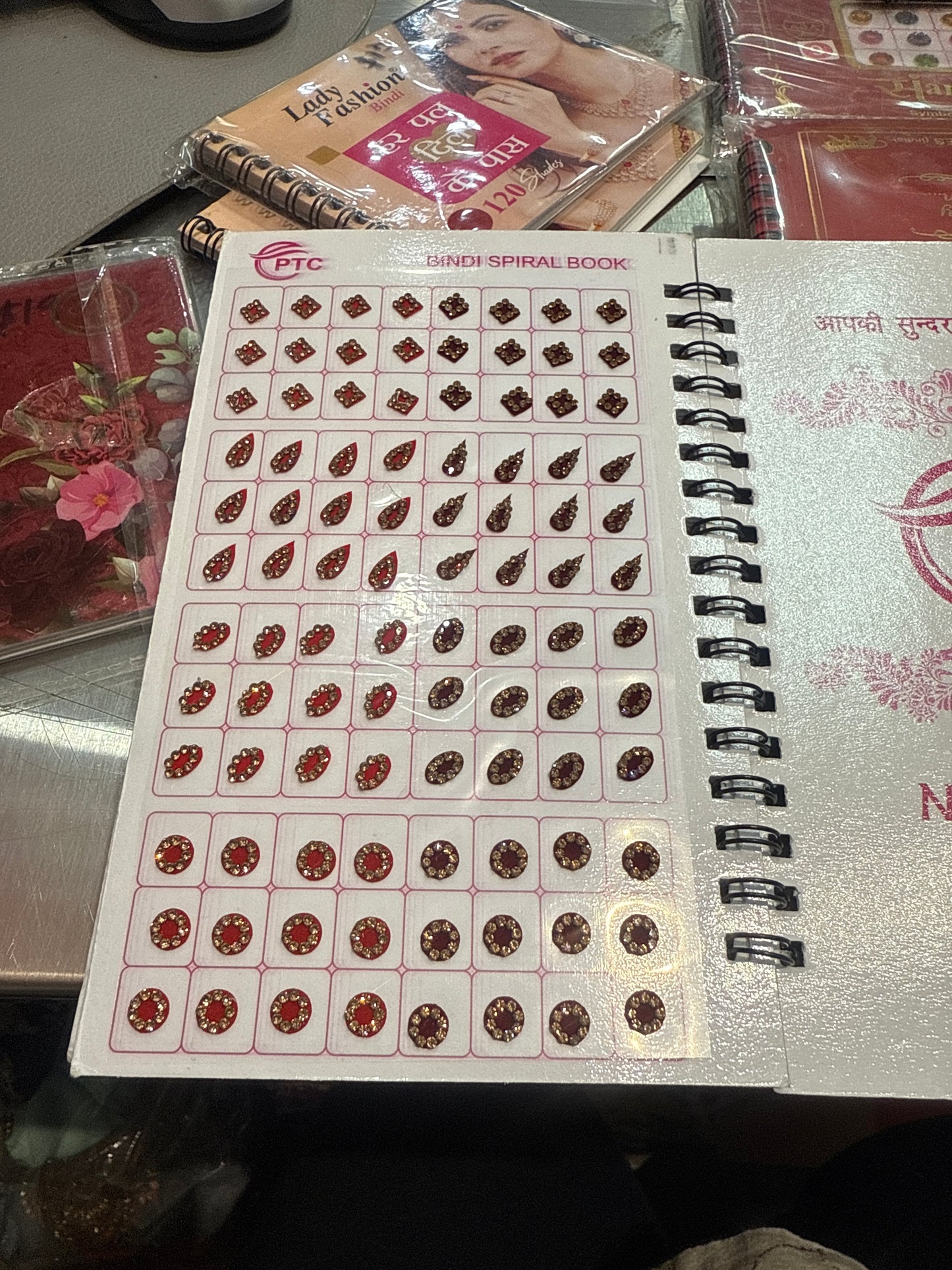 Beautiful designer gold stone tikka/bindi book