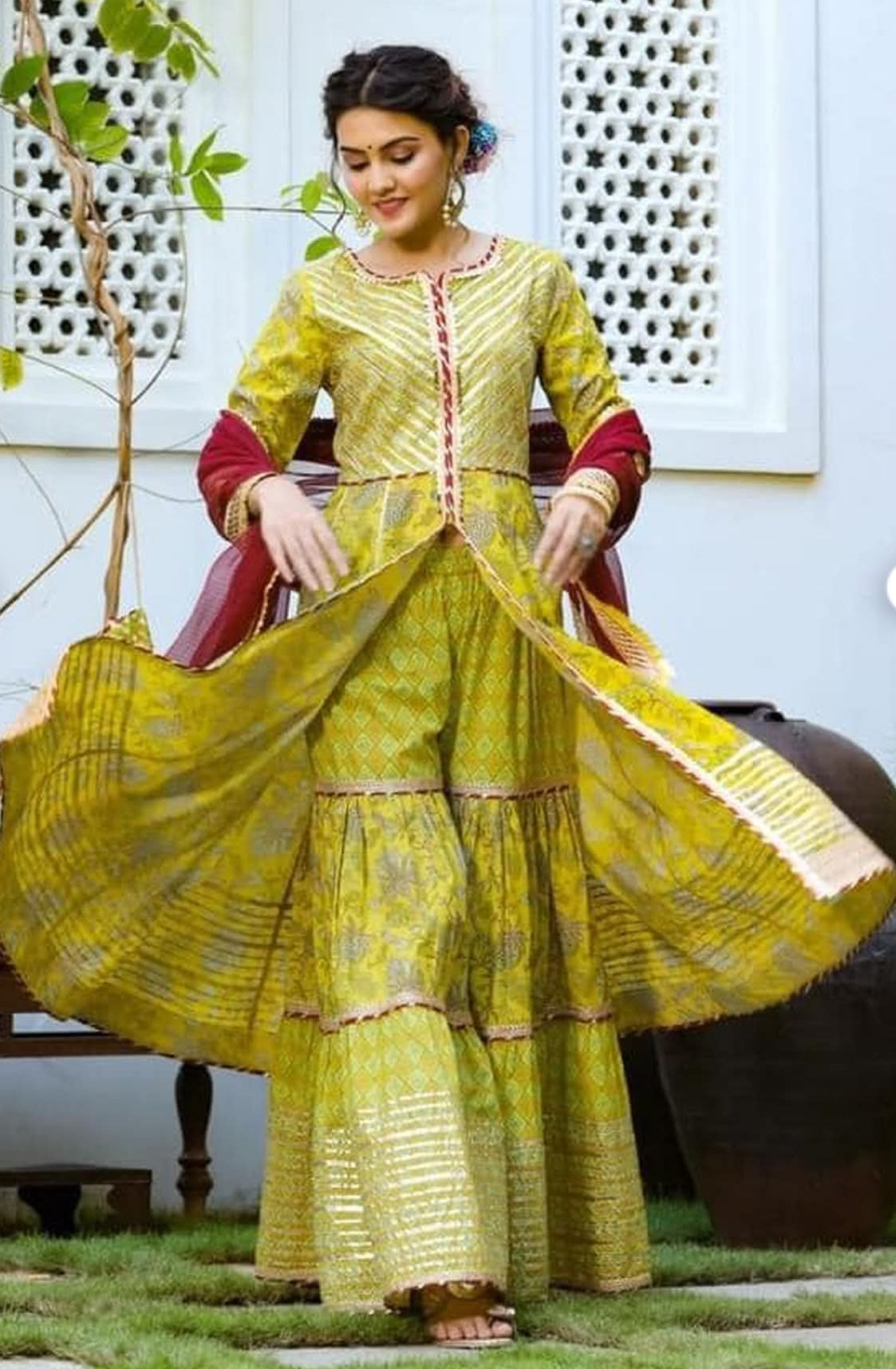 Beautiful designer sharara suit with matching potli