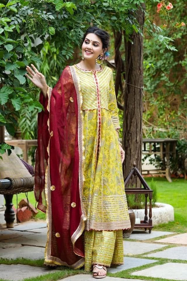 Beautiful designer sharara suit with matching potli