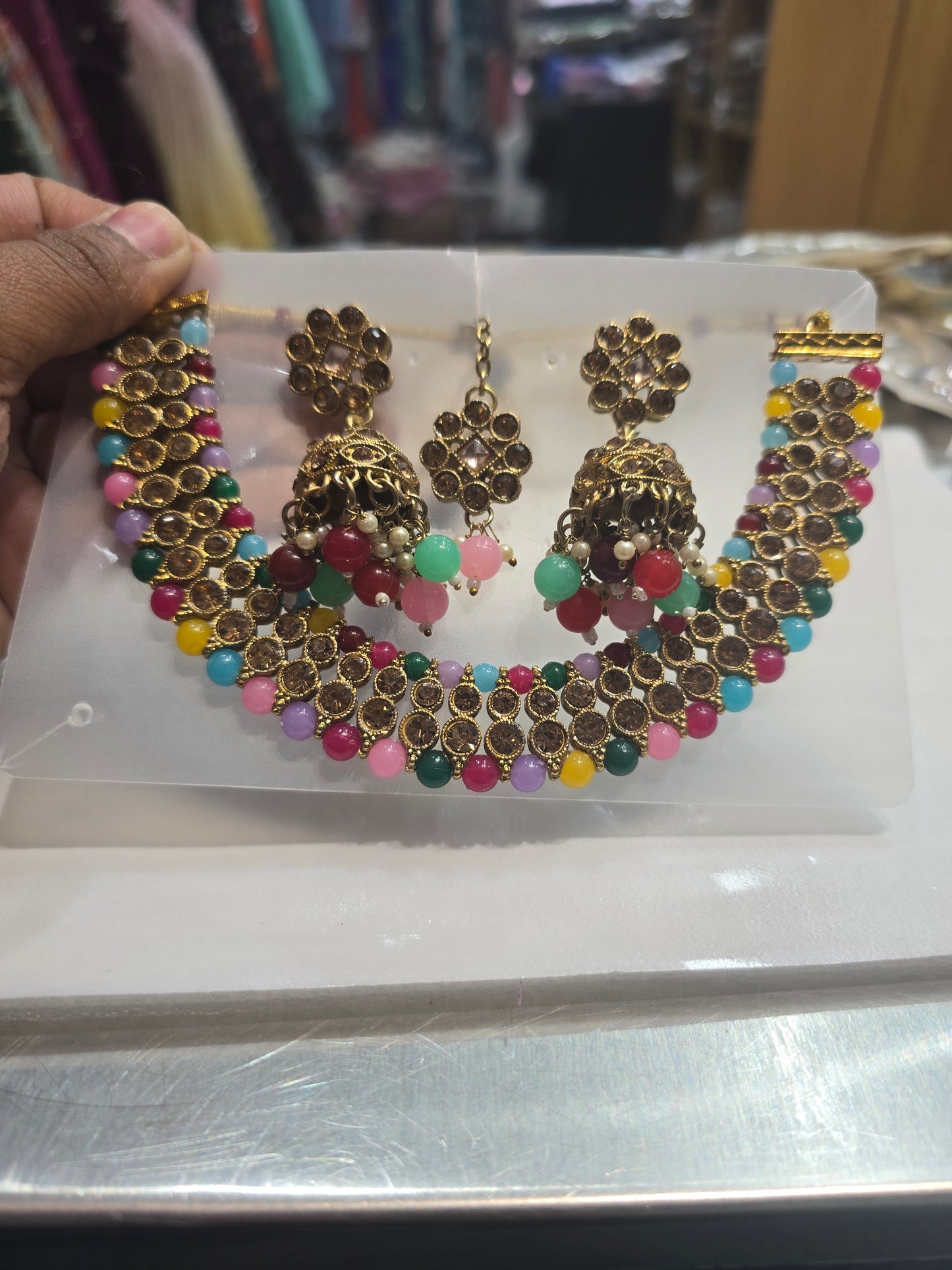 Beautiful designer necklace set with matching jhumki earrings and bindi